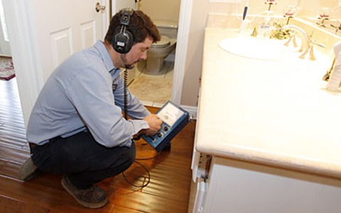 technician checking moisture issues